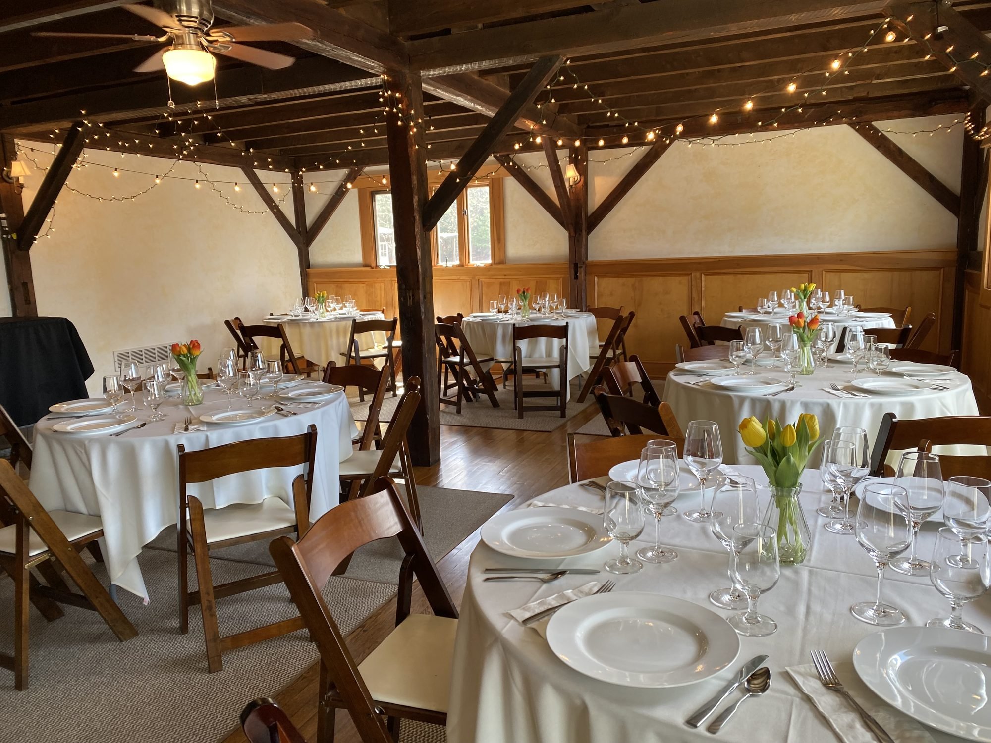 full-barrel-room-string-lights-dining-tables-the-summit-winery.jpg