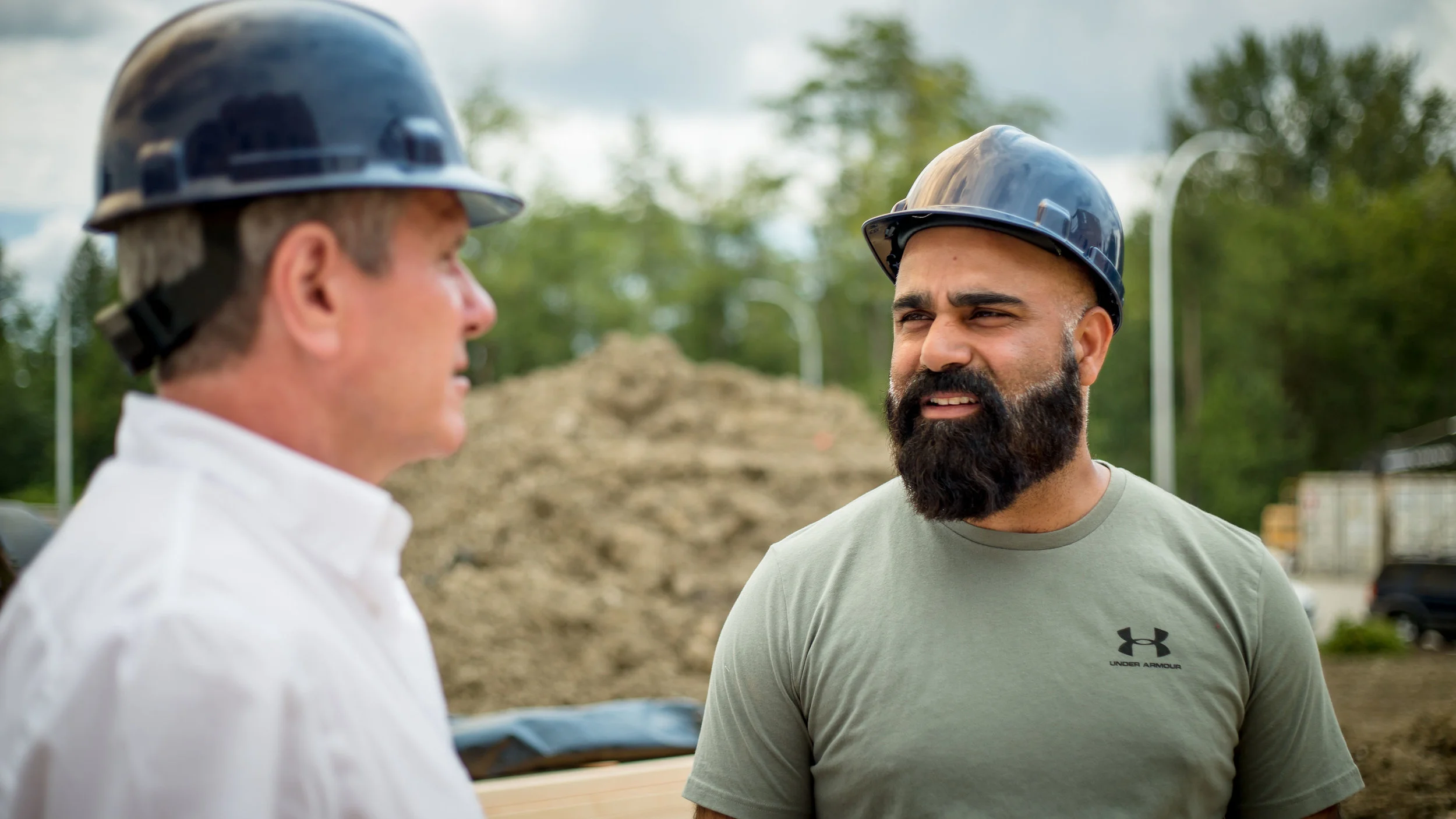 John speaks with worker on a Cloverdale - Langley City construction site