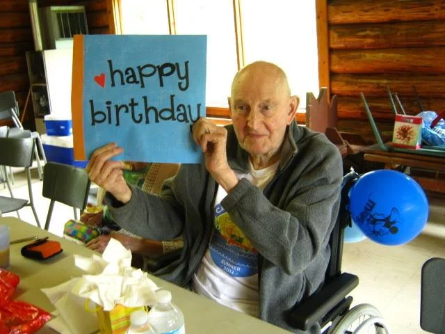 Gerry Alexander celebrating a birthday at Camp Maskepetoon