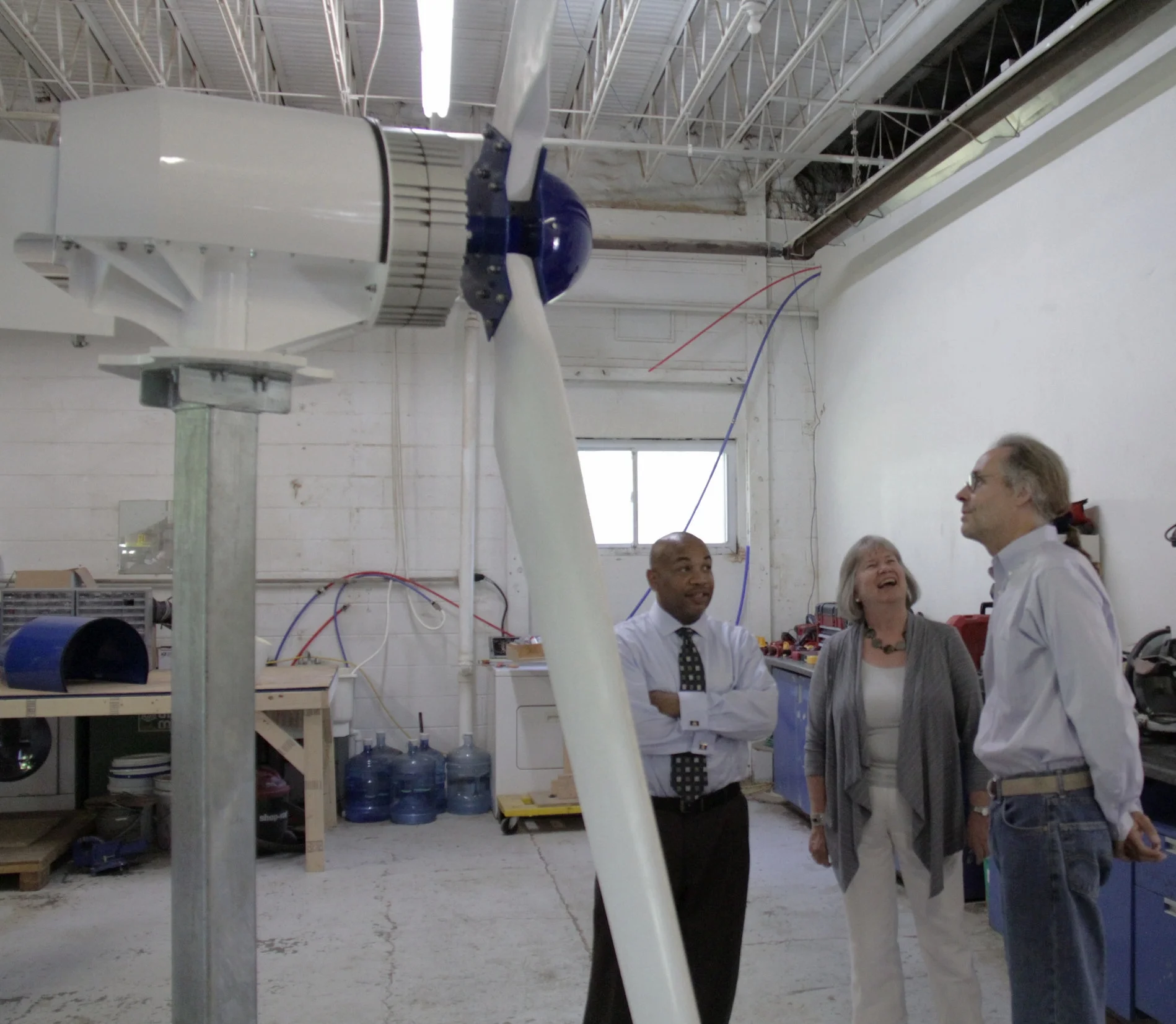 Carl Heastie, D-Bronx, left, speaker of the NY State Assembly, and Assemblywoman Barbara Lifton, D-Ithaca, talk to Weaver Wind Energy president Art Weaver at an open house.