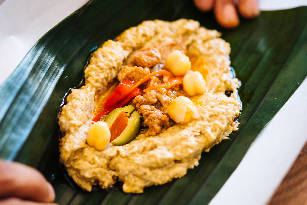 Folding pasteles in banana leaf.jpg