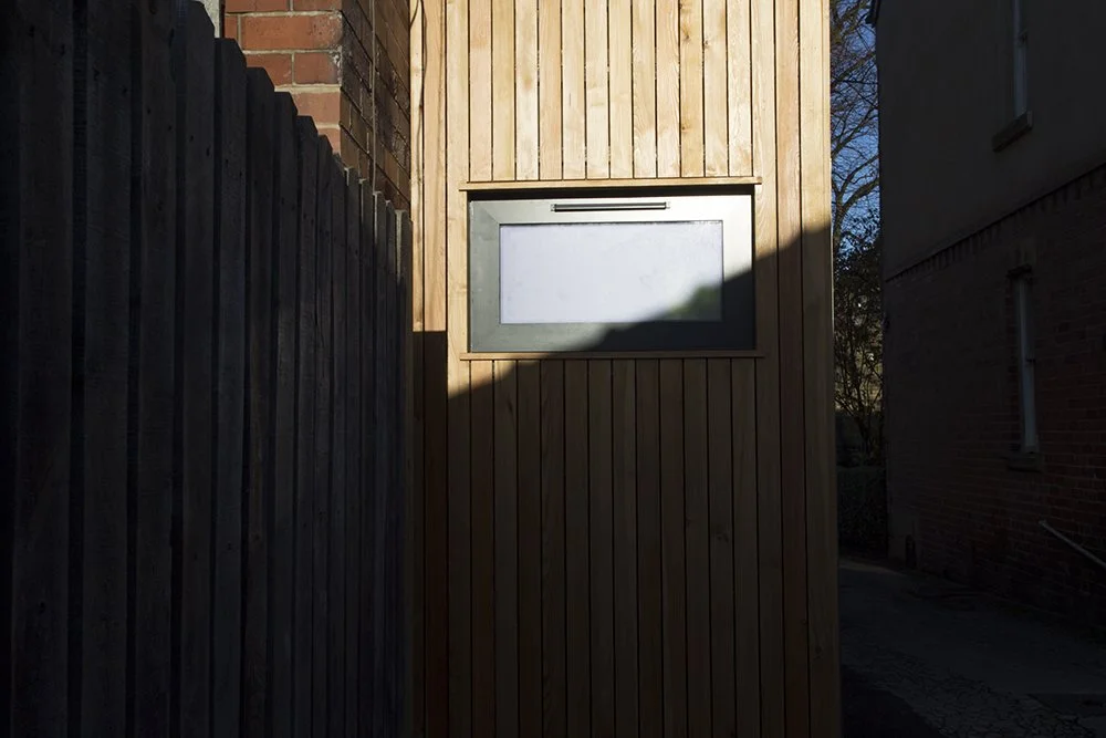 A small timber and glass extension to a Victorian terrace in Sheffield housing a WC and entrance hall by SJW Architects.