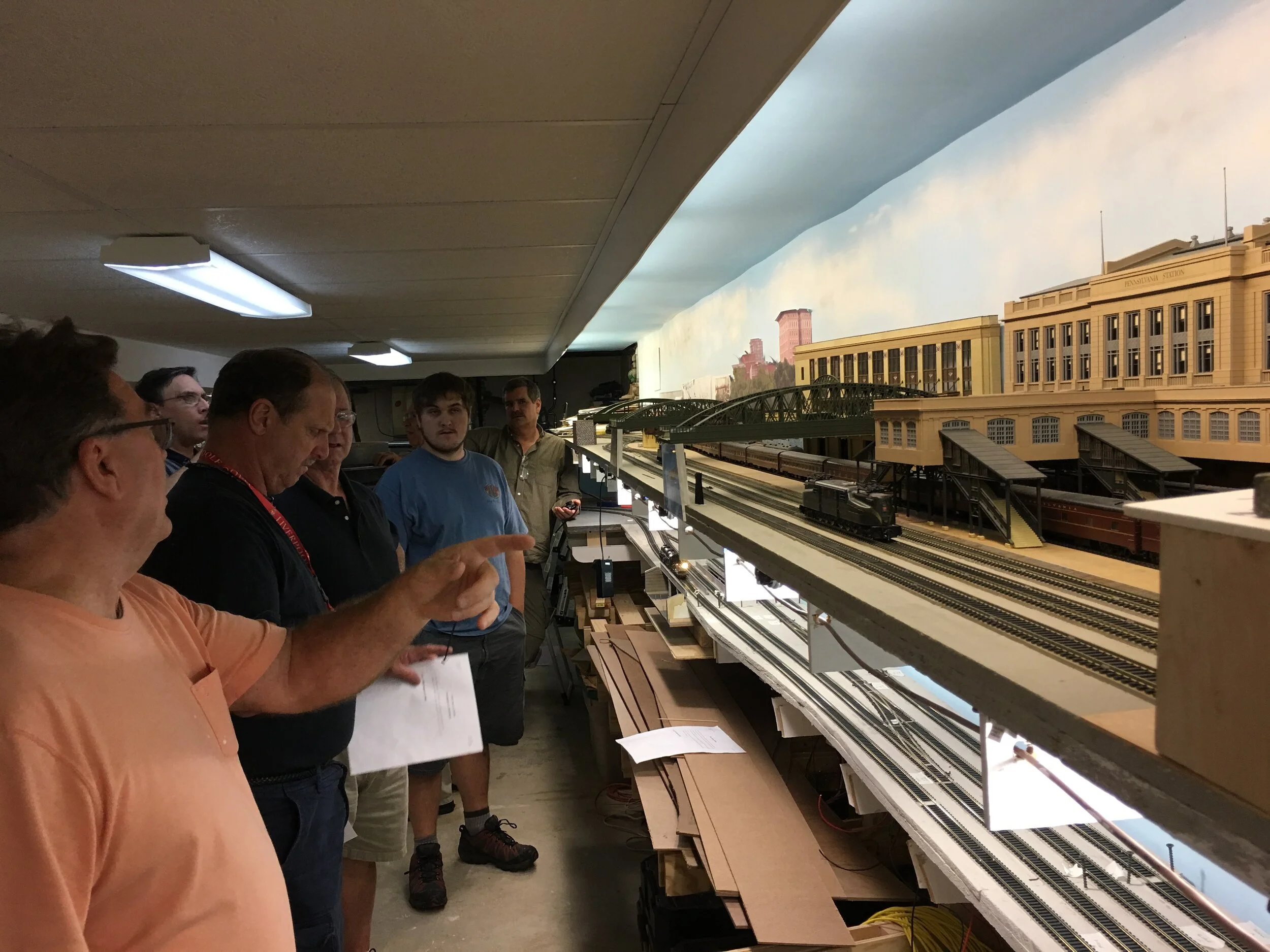 Ken (foreground) showing off his layout to visitors.