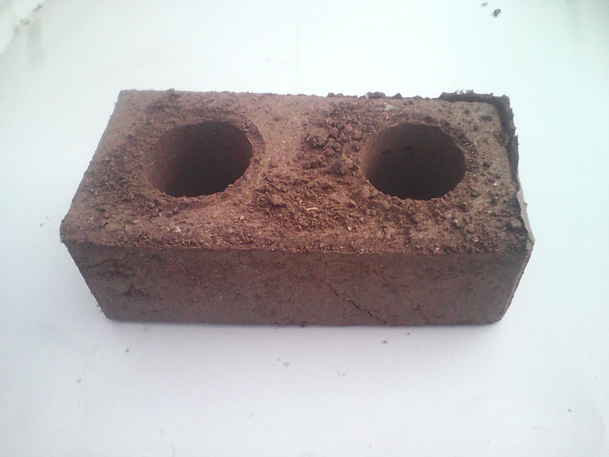 a fine new brick made of earthquake rubble.jpg