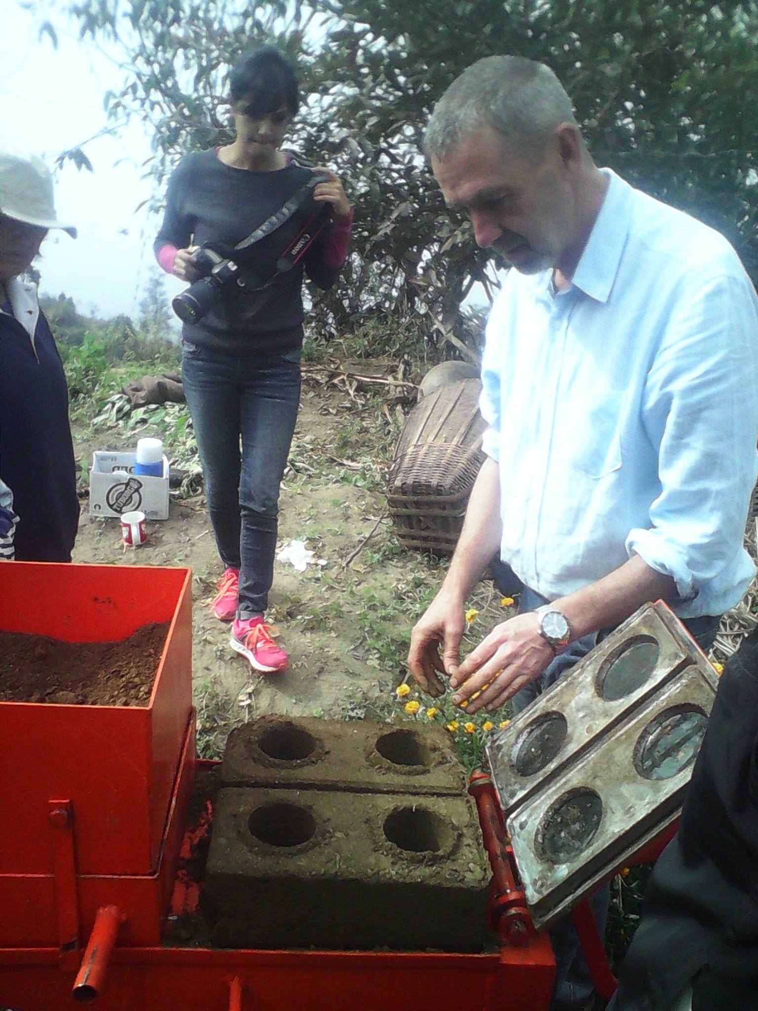 Steve learns to use the brickmaking machines from China .jpg