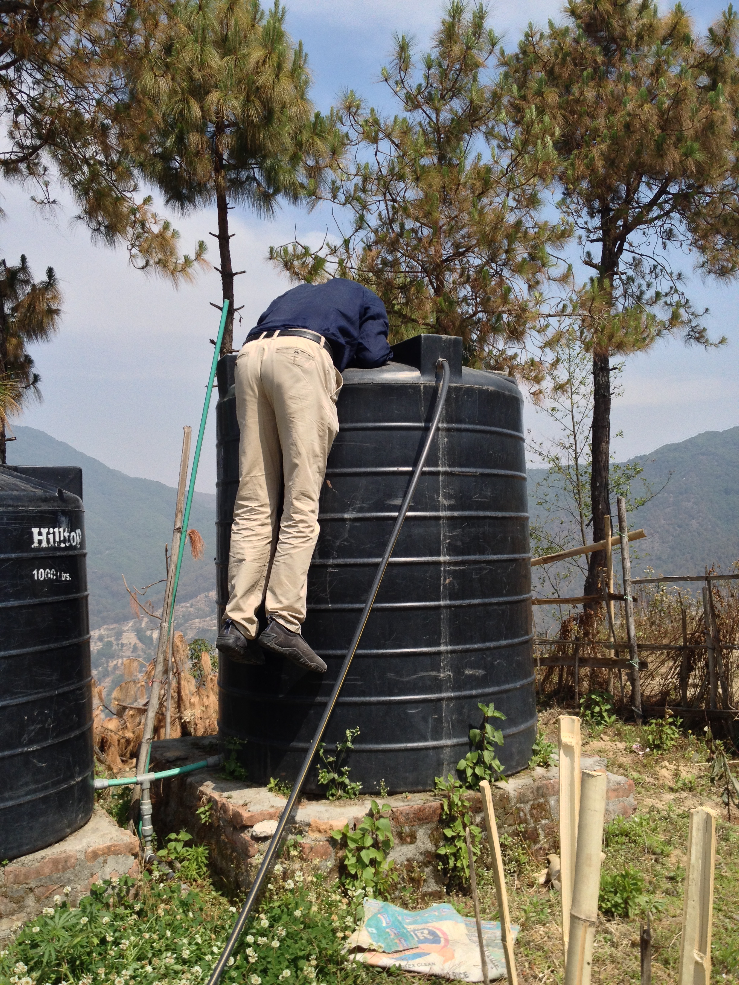 steve checks out the water tank problem.jpg