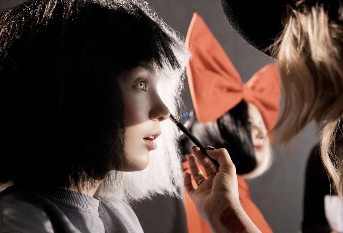 Maddie Ziegler gets a touch-up on set