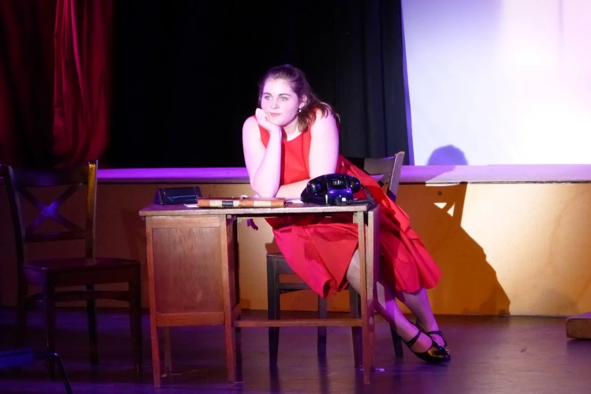 phoenix-youth-theatre-2014-pajama-game-office-scene-red-dress-desk-telephone.jpg