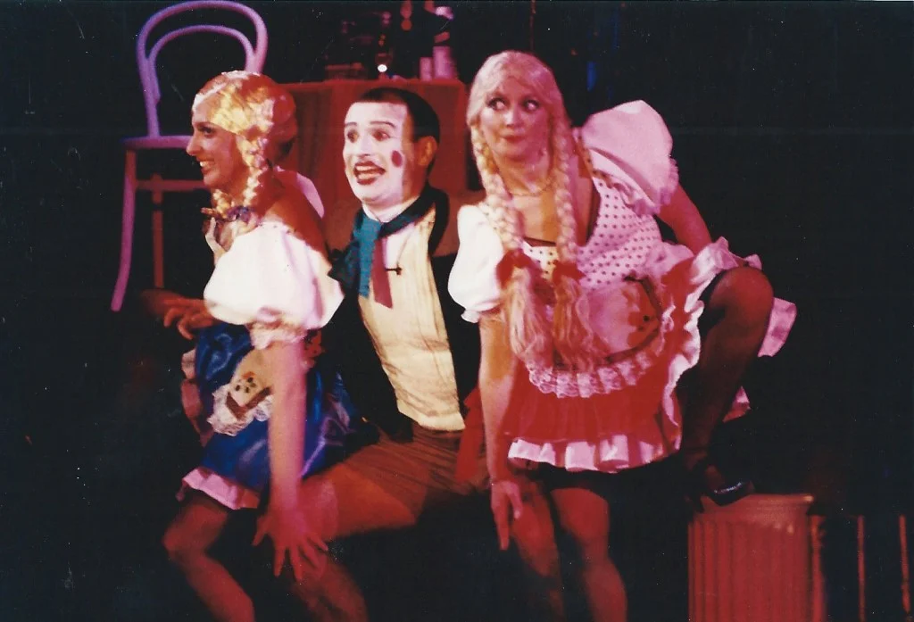 “Two Ladies” number: the Emcee cavorts with two blonde companions in comic drag — Phoenix Theatre’s Cabaret, 1991.