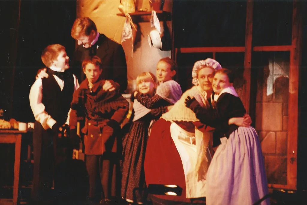 phoenix-theatre-1999-scrooge-cratchit-family-by-the-hearth.jpg