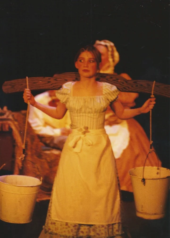 phoenix-theatre-oliver-2002-workhouse-girl-carrying-water-buckets.jpg