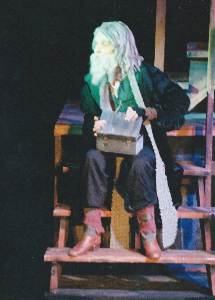 phoenix-theatre-oliver-2002-fagin-counts-loot-on-stairs.jpg