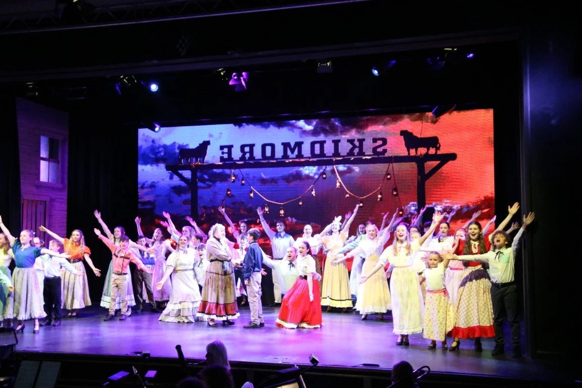 phoenix-youth-theatre-oklahoma-2023-ensemble-arms-skidmore-ranch.jpg