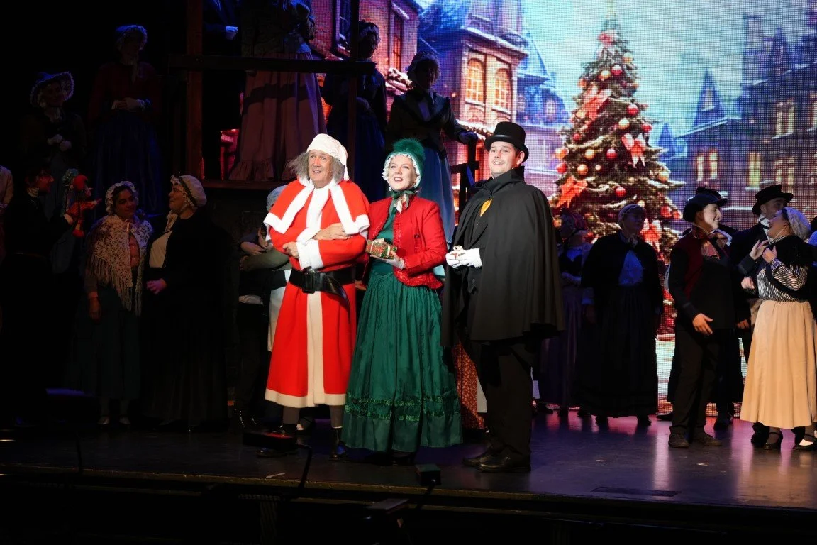 scrooge-2023-finale-scrooge-in-red-coat-christmas-tree-phoenix-theatre-aberdeen.jpg