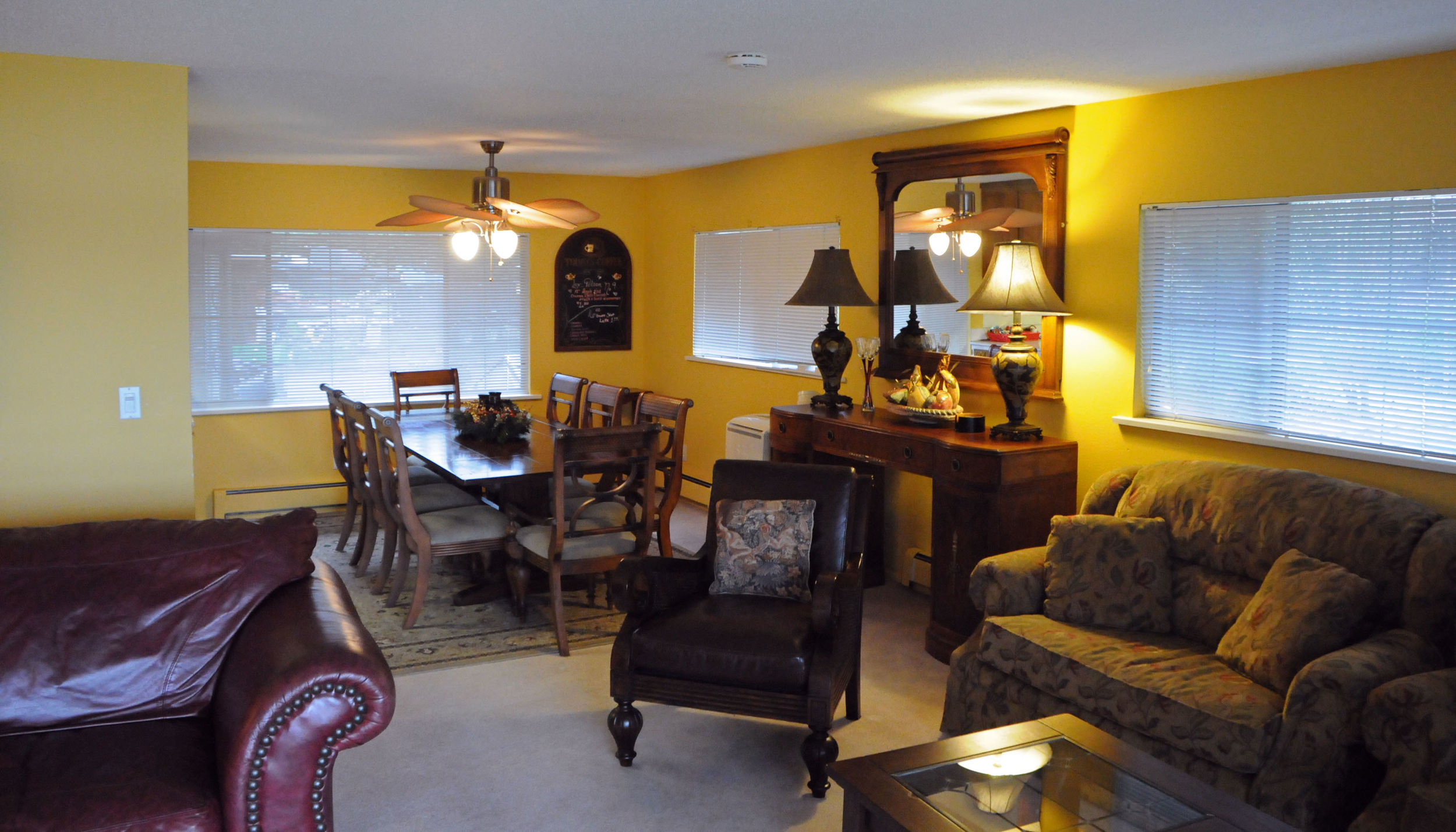 Maximum occupancy of 6. Living room with lake view, fireplace, private balcony with lake view, 2 bedrooms (1 king, 1 queen), 2 bathrooms, full kitchen, dining room, and 2 over-stuffed chairs with pull-out twin beds in the living room.