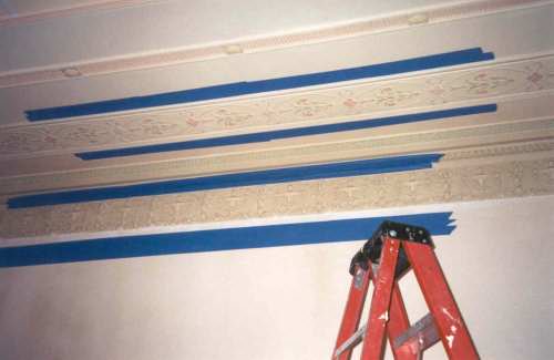  Some of the original ceiling moldings had been damaged over the last 90 years and needed to be restored. The first step was to mask off an original good area to be duplicated. 