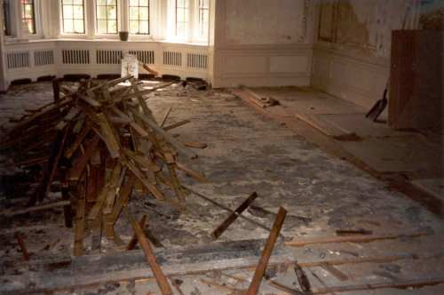  One of many piles of old floor, making a huge pile in total. Almost 4,000 square feet of old floor was removed. 