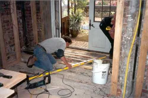 Some wooden "sleepers" or 2x3's were replaced, cemented in and leveled. These are what the old floor is nailed to. The sub floor is solid concrete in the Castle. These wood strips are then cemented in.