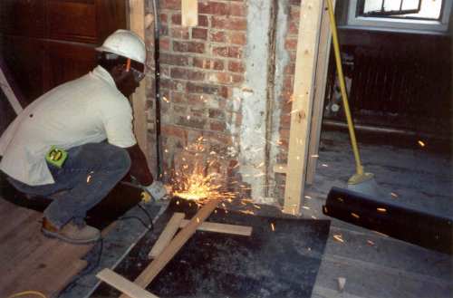  The new floor was laid, occasionally needing to cut out old obstacles. 