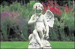 The coy angel in the center of the secret garden is one of the few remaining original pieces of statuary at Thornewood.