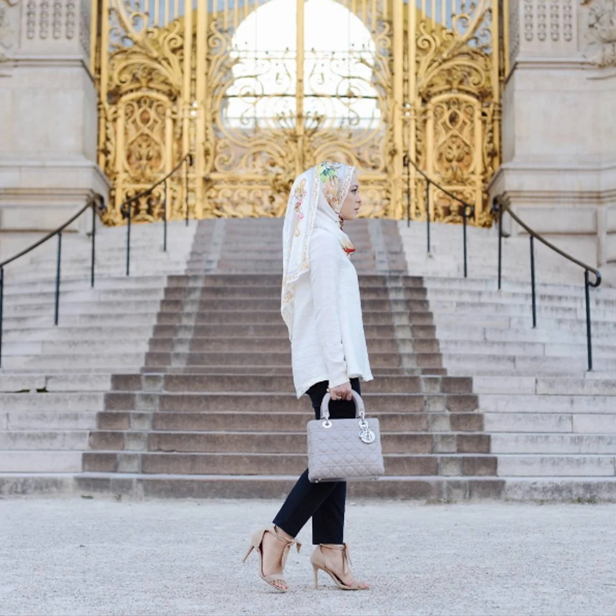 Vivy is breathing the Parisian air while standing in front of the iconic golden gate of Grand Petit Palais. Picture Credit to @thedUCkgroup media