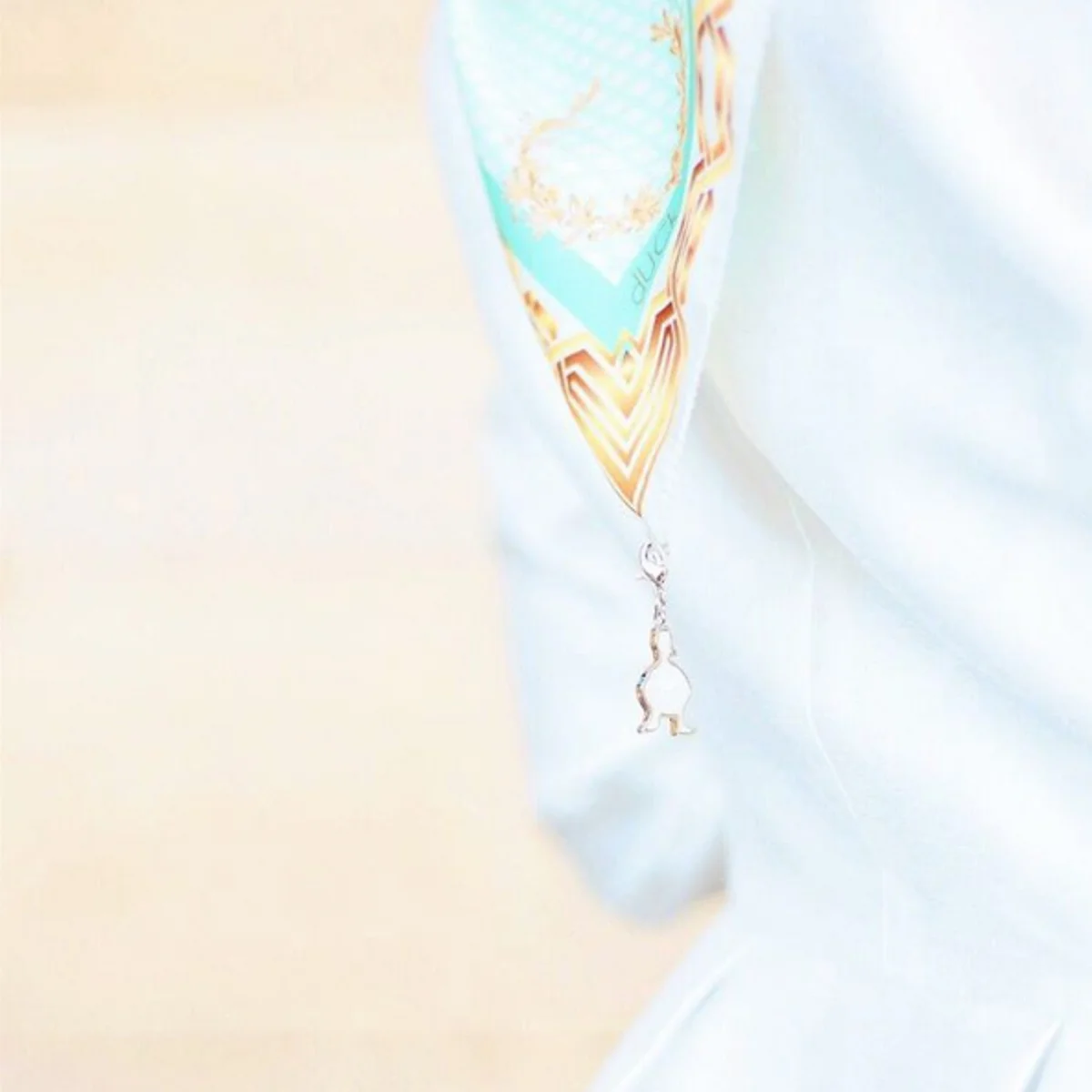 The detail of the hanging dUCk charm, covered in mother of pearl, which symbolises the creation that blends the two brands seamlessly. Picture Credit to @thedUCkgroup media