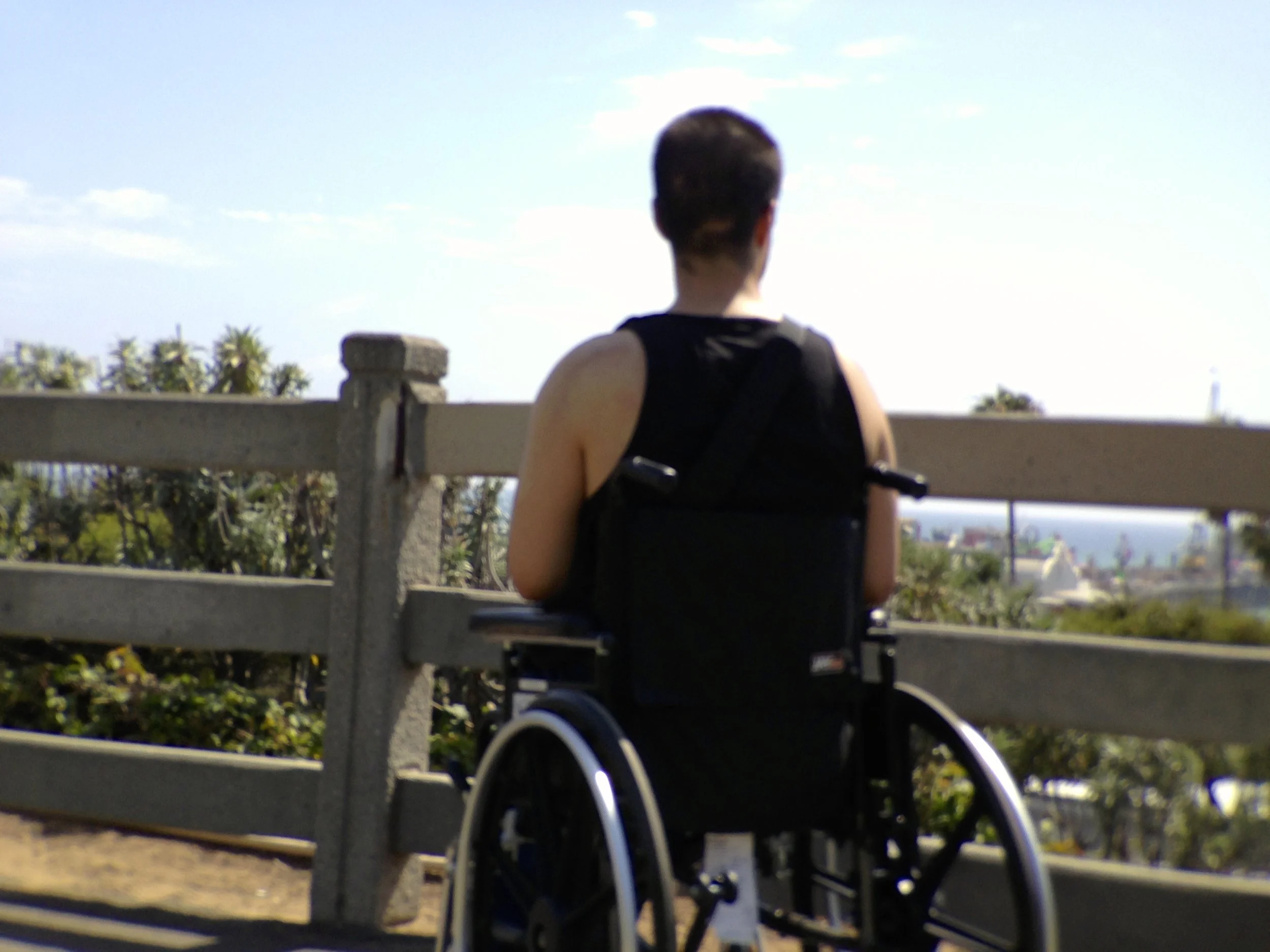 216. MAN IN WHEELCHAIR WATCHING THE SEA_IMG_1745 2.JPG