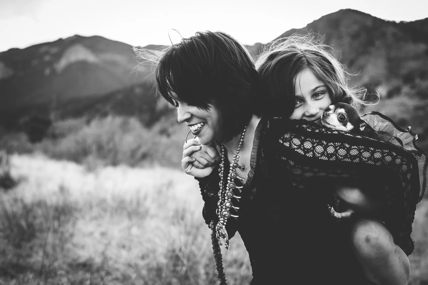 Mother, daughter and their dog enjoy their time in the Colorado Springs mountains during photo session.