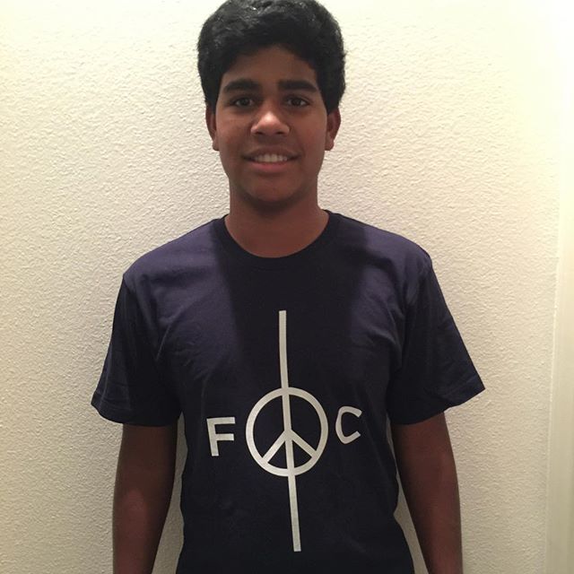 A cool kid I know in a cool Peace FC t-shirt prototype.  Thanks for modeling O.