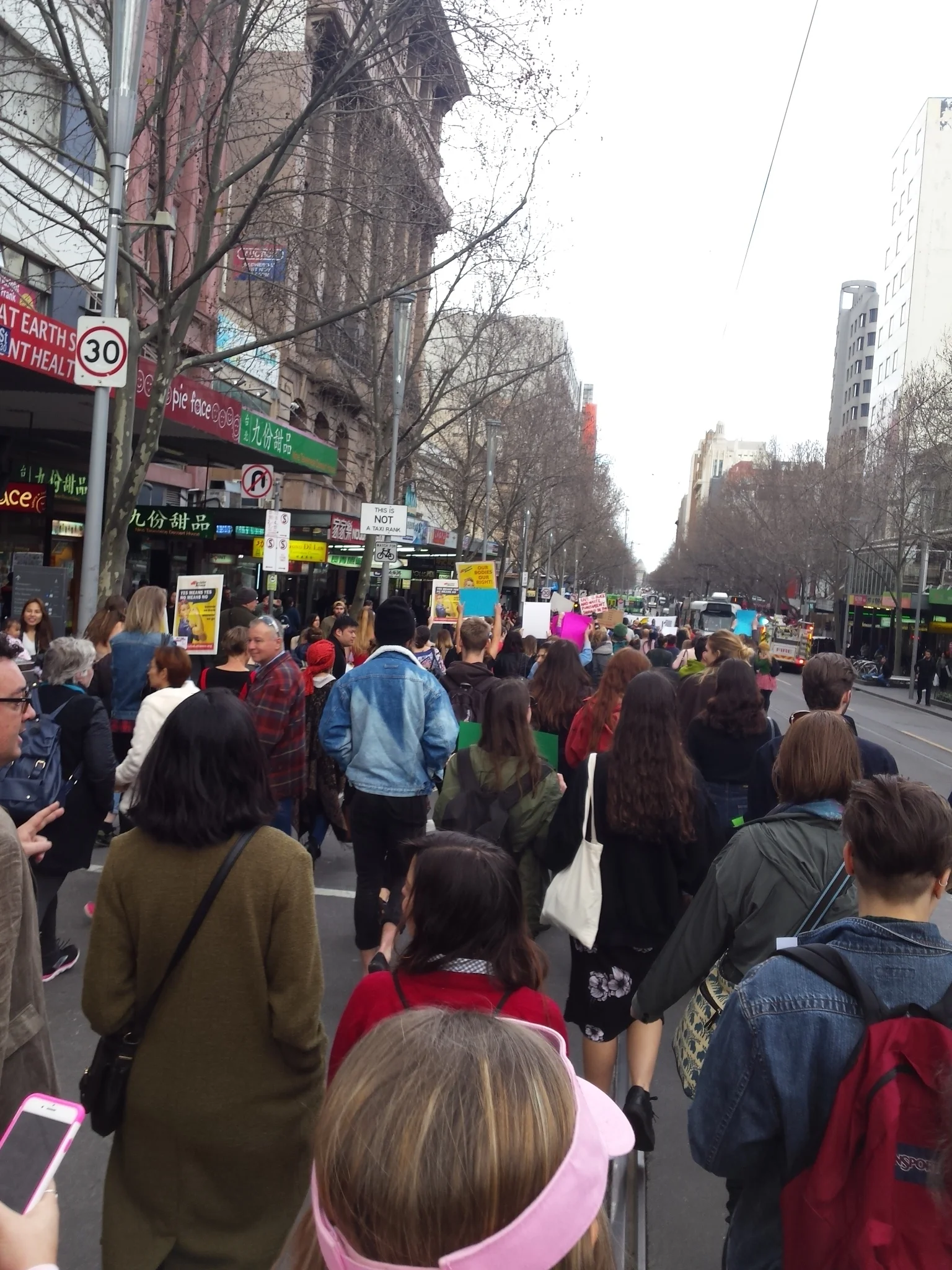 We march on down Swanston Street Melbourne as we chant 