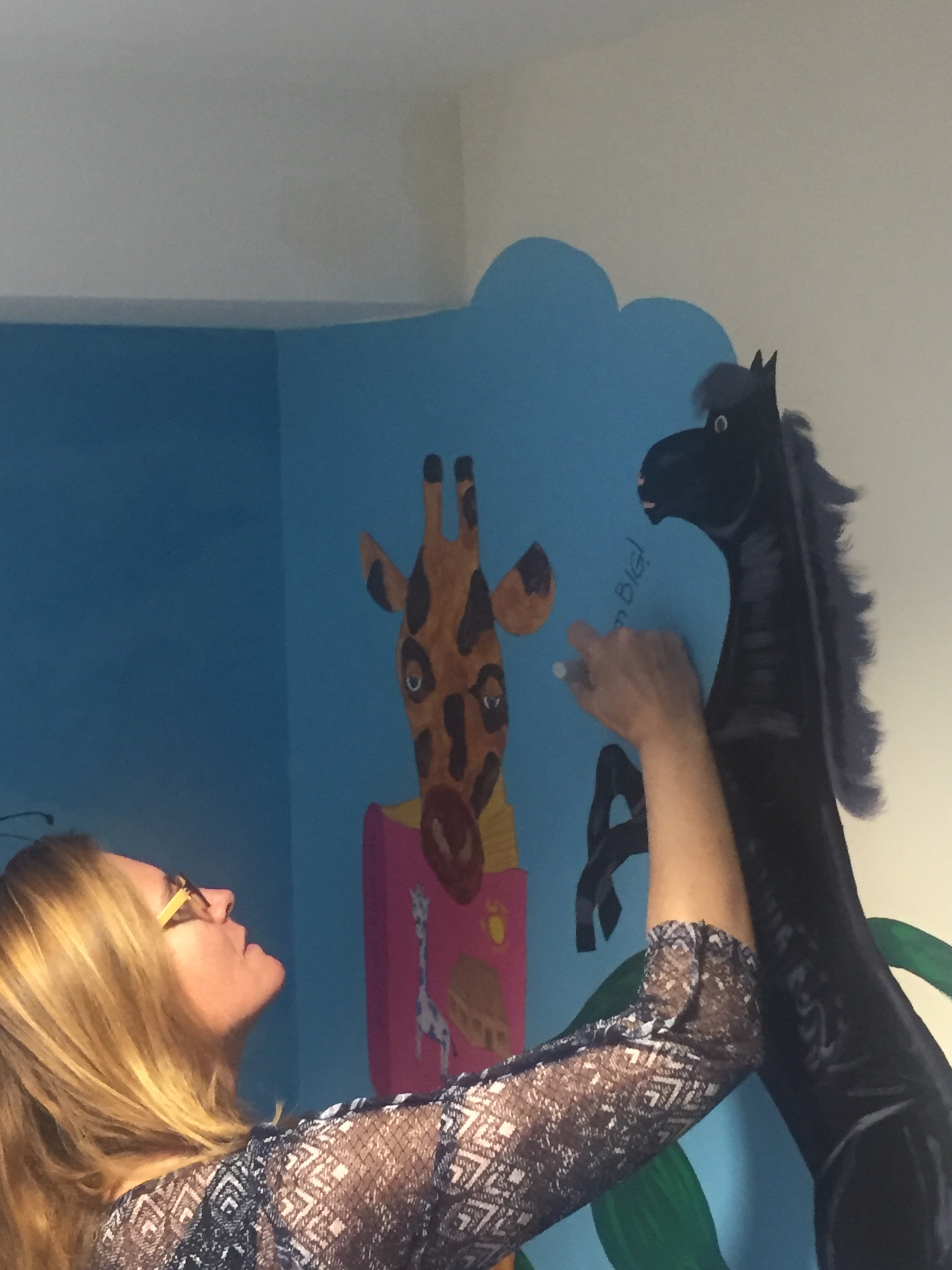 signing the school mural:)