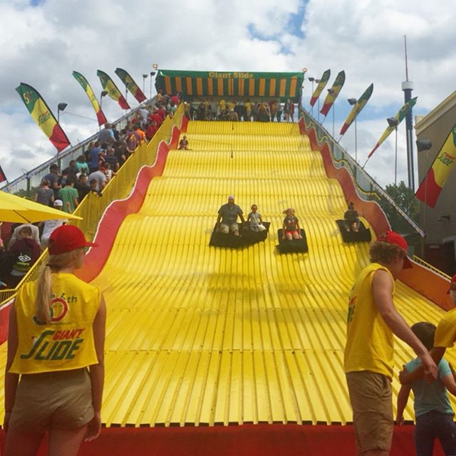 a yellow (af)fair. 🎢🍪🍊☀️🧽🌽
.
.
#minnesotastatefair #giantslide #cookies #buttercarving #butter #pumpkins #corn #cornonthecob🌽 #summerfun