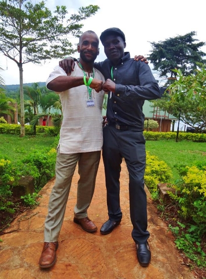Omari with his sponsored student, Kafumufu Joseph, in Uganda.