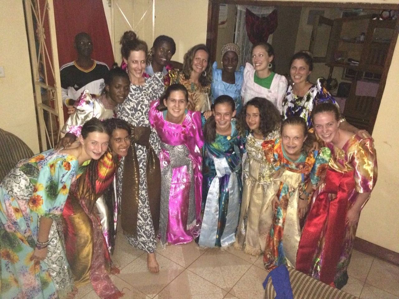 Students and S.O.U.L. staff wearing Gomesi, traditional women's wear, prior to celebrating their last night in Bujagali Falls. It was a night full of speeches, dancing, tears, and laughter!
