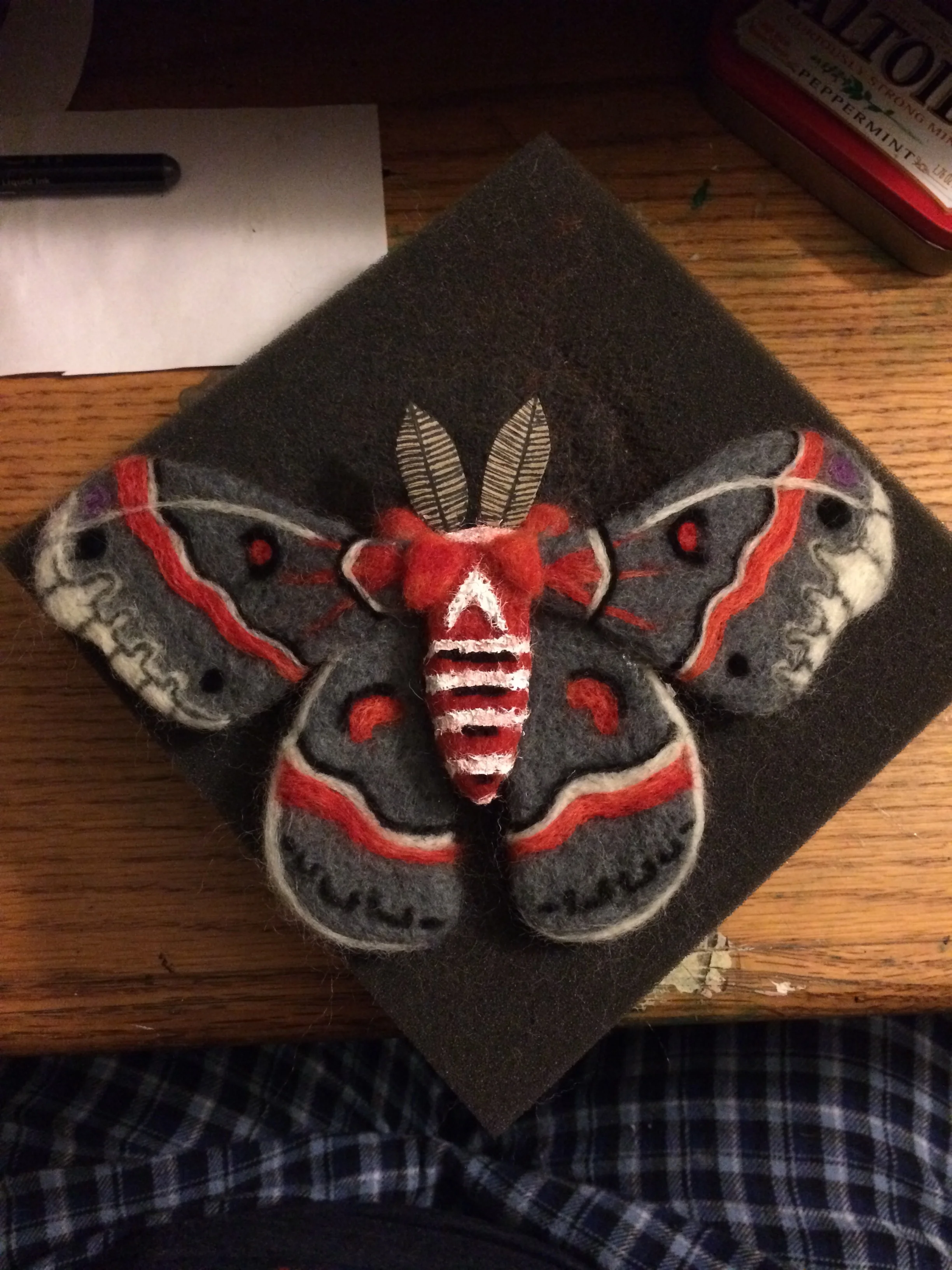 A cecropia moth made by wool needle felting.