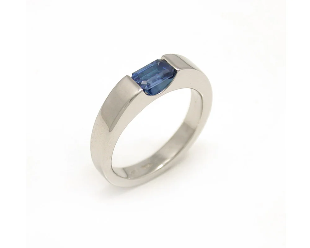 white-gold-emerald-cut-blue-sapphire-solitaire-channel-set-handmade-engagement-ring.jpg