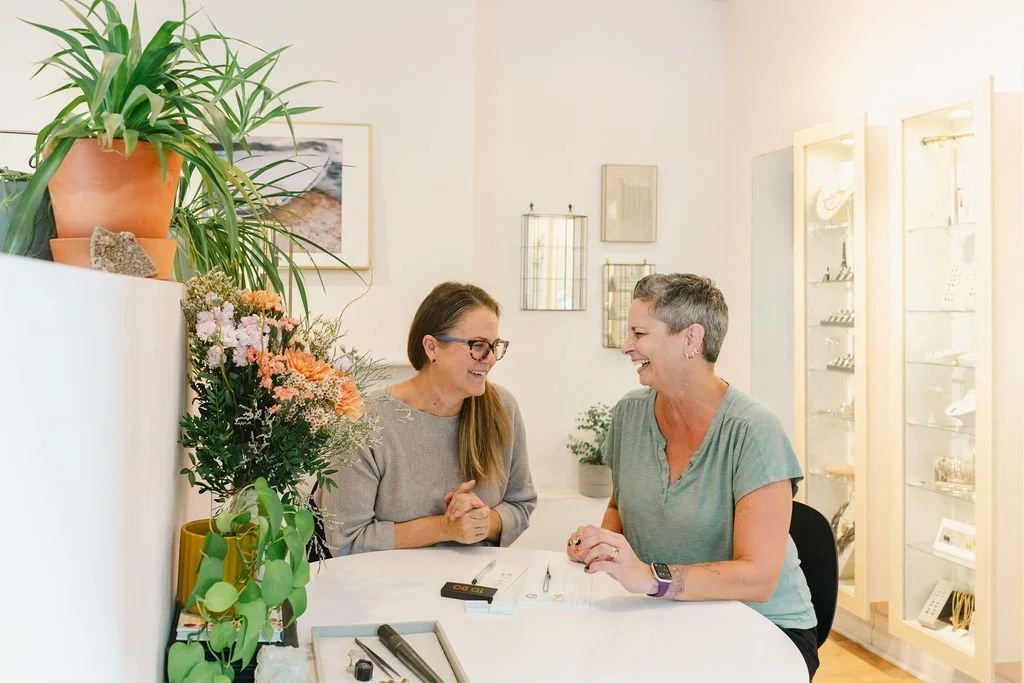 kim drosdick meeting with a client about a custom redesign at her meeting table in her shop in Toronto
