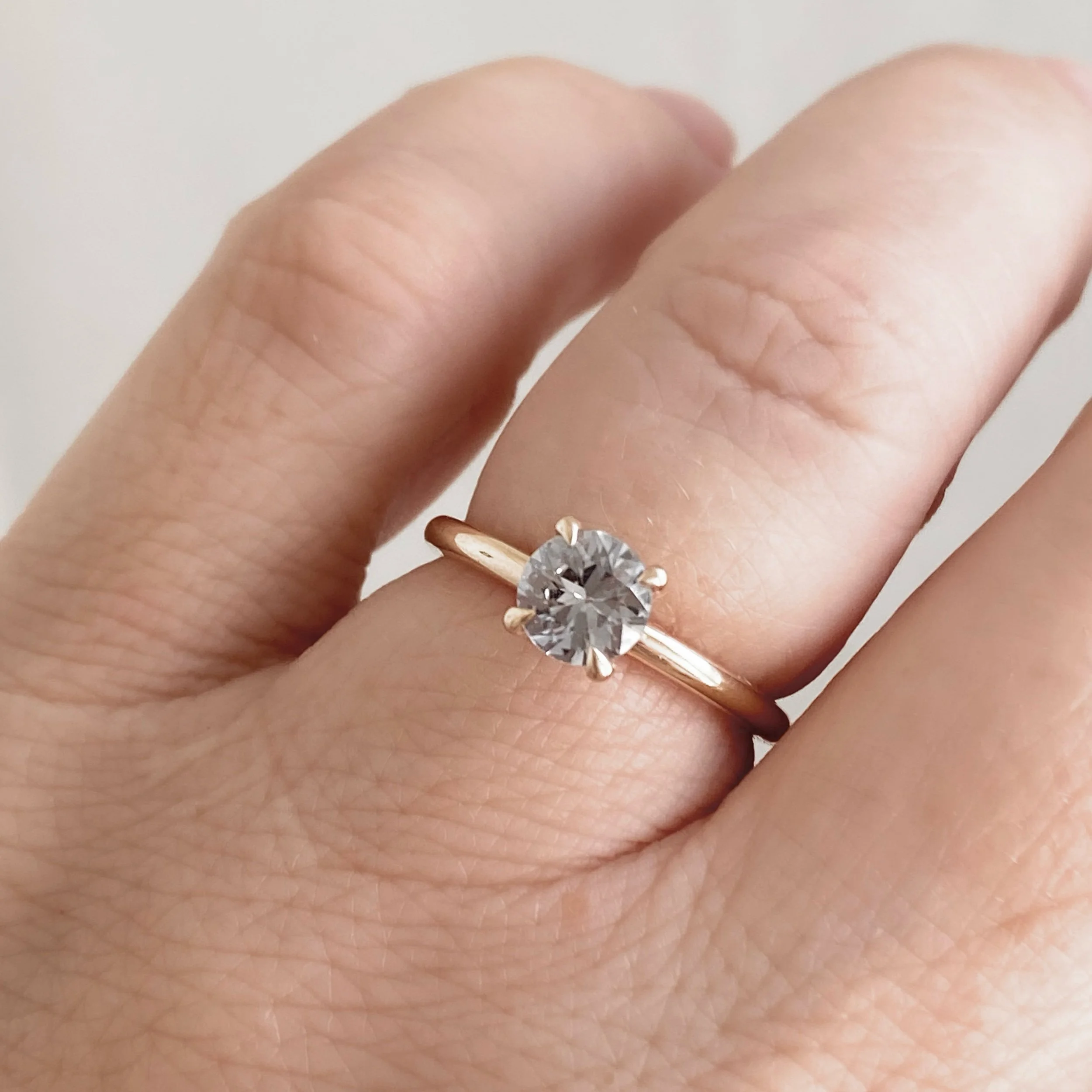 greige sapphire solitaire 14k yellow gold engagement ring toronto Kim Drosdick jewellery on hand