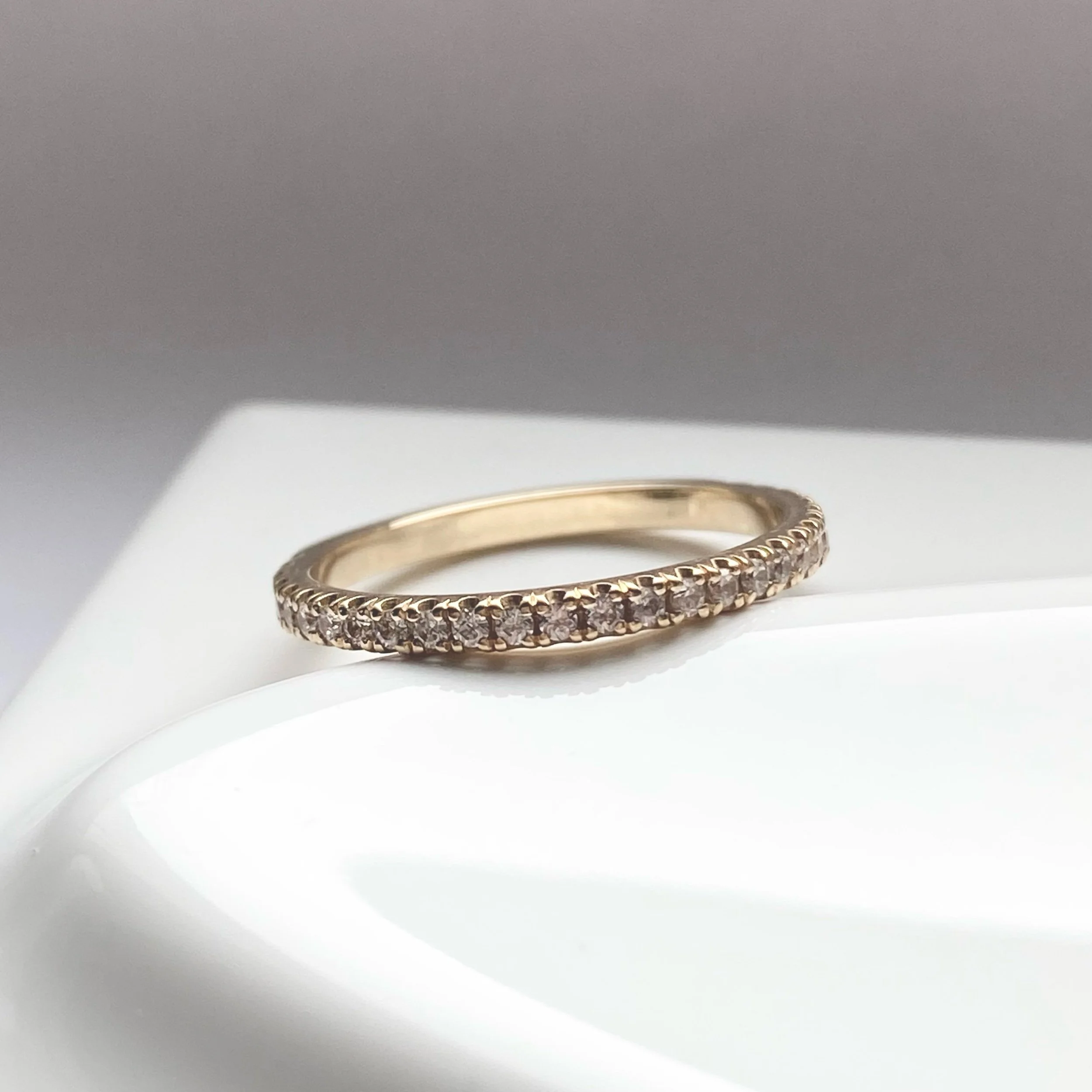 lab grown diamond french pave wedding band recycled 14k yellow gold on prop