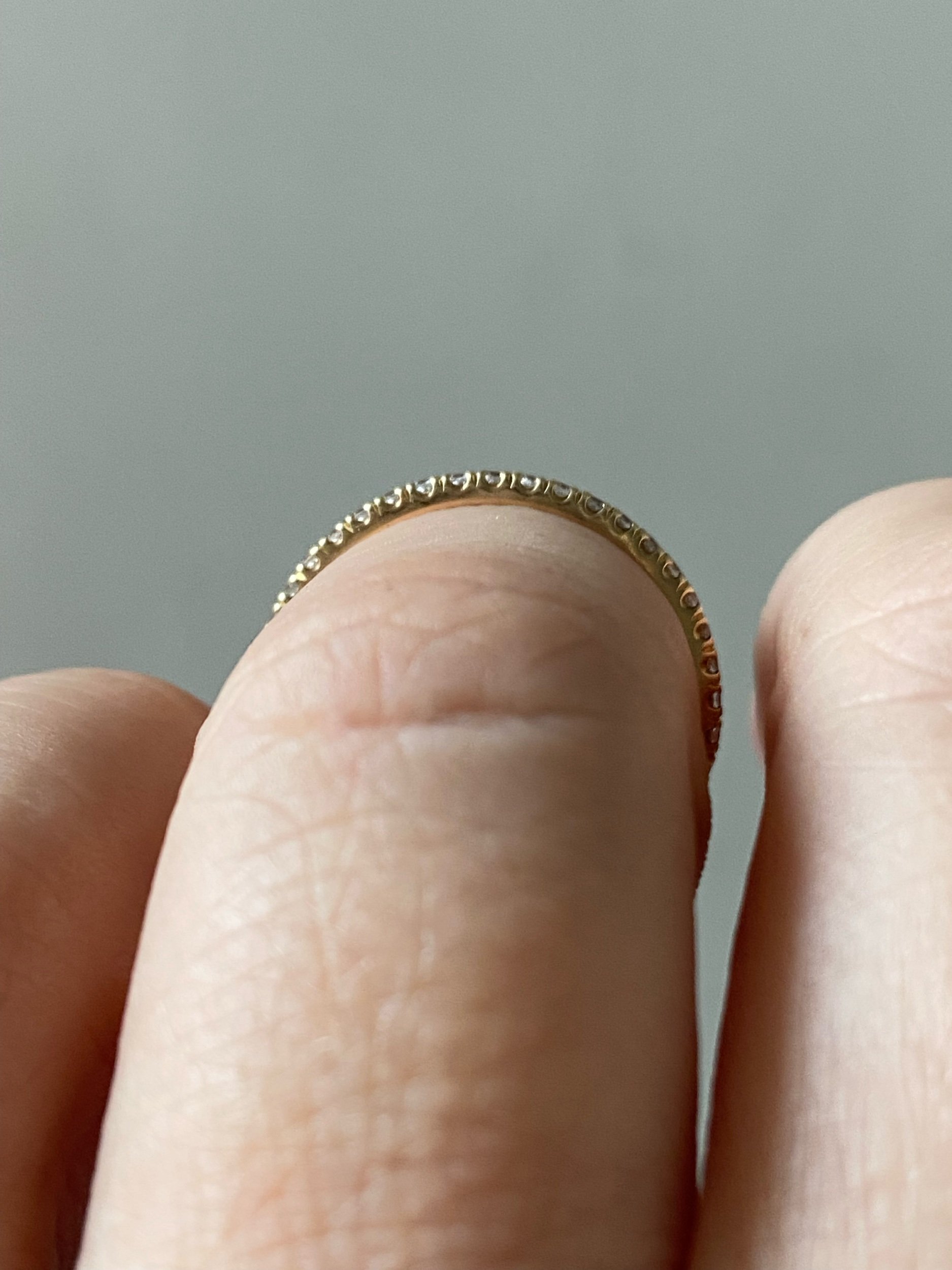 lab grown diamond french pave wedding band recycled 14k yellow gold on hand side view