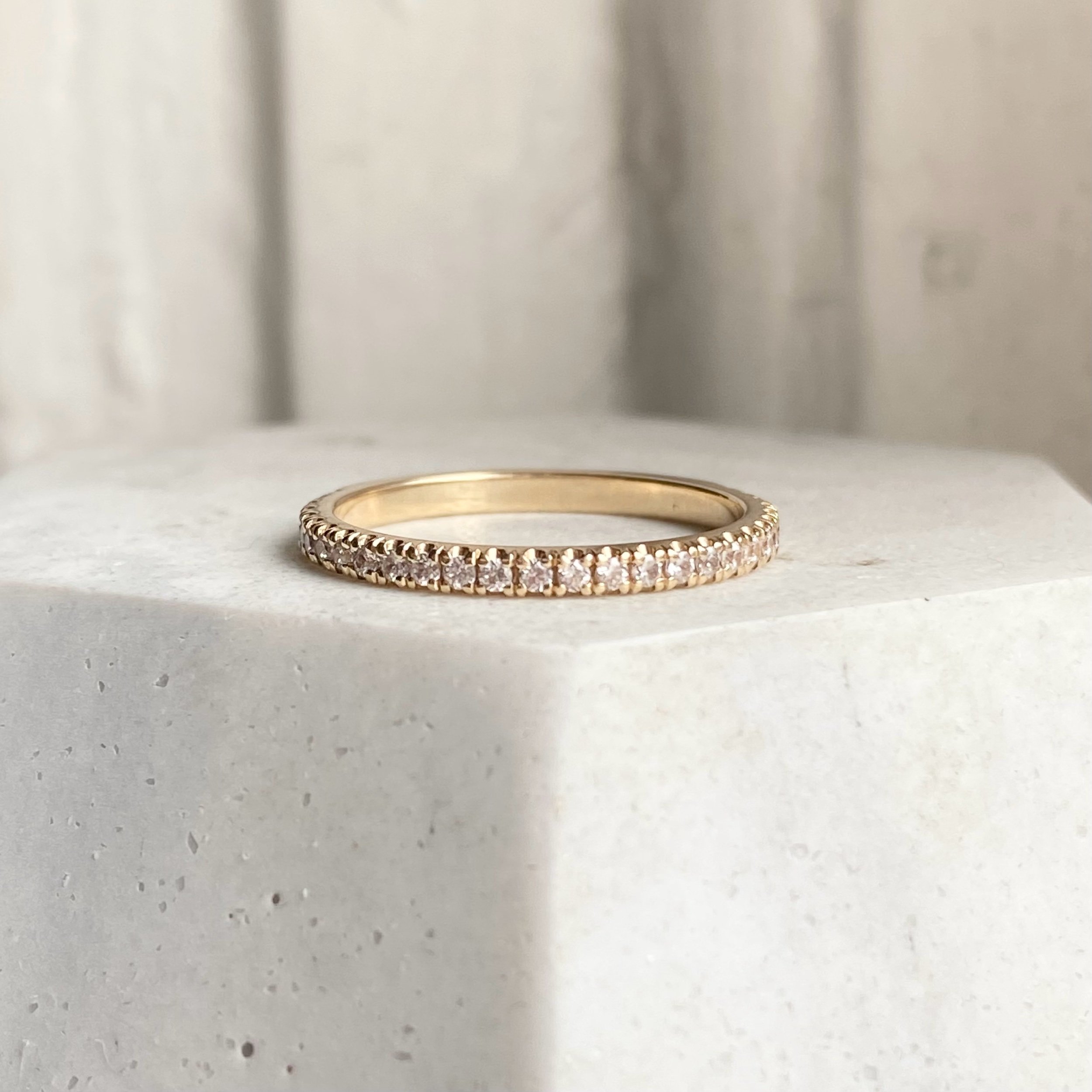 lab grown diamond french pave wedding band recycled 14k yellow gold on prop