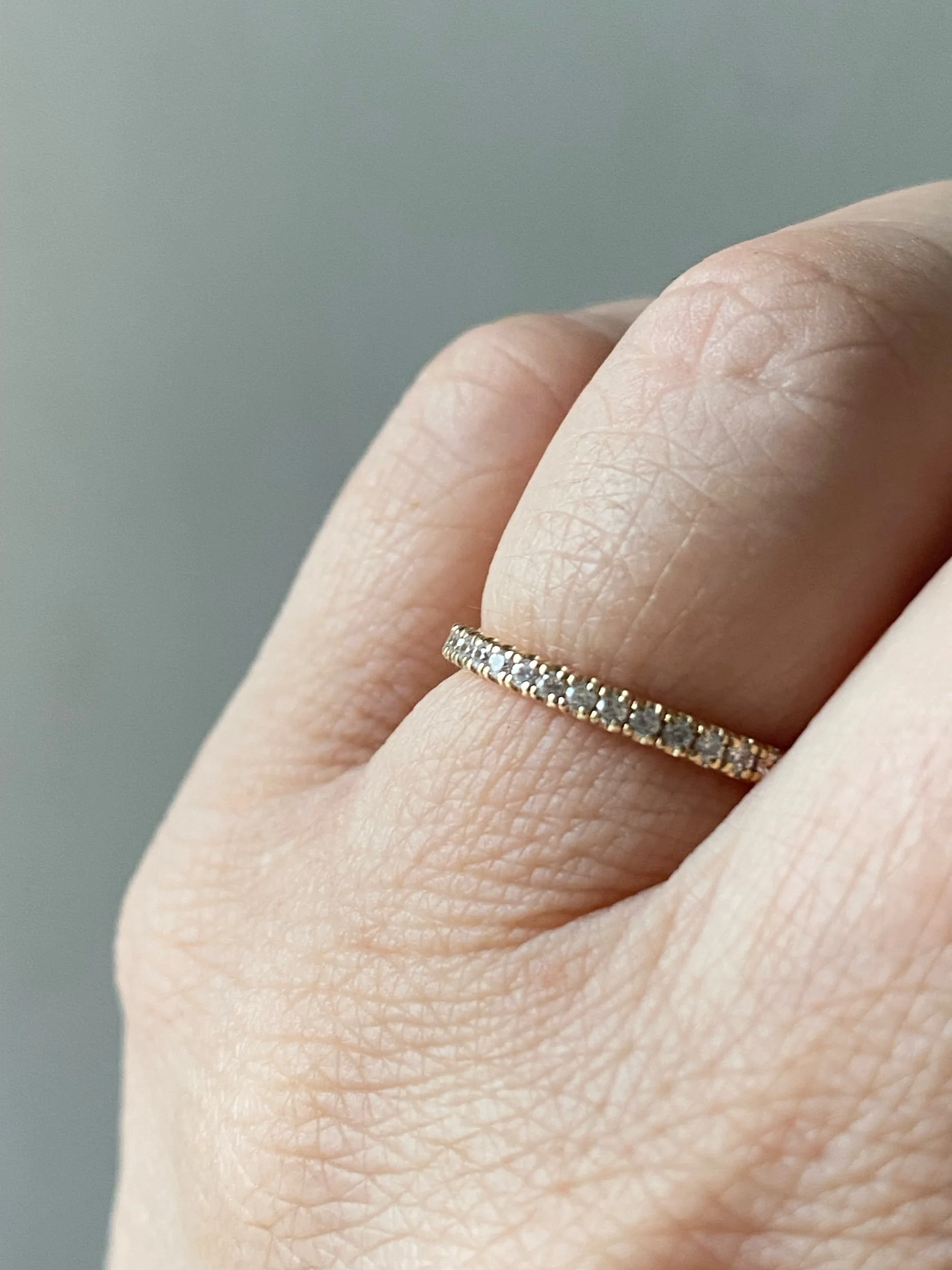 lab grown diamond french pave wedding band recycled 14k yellow gold on hand