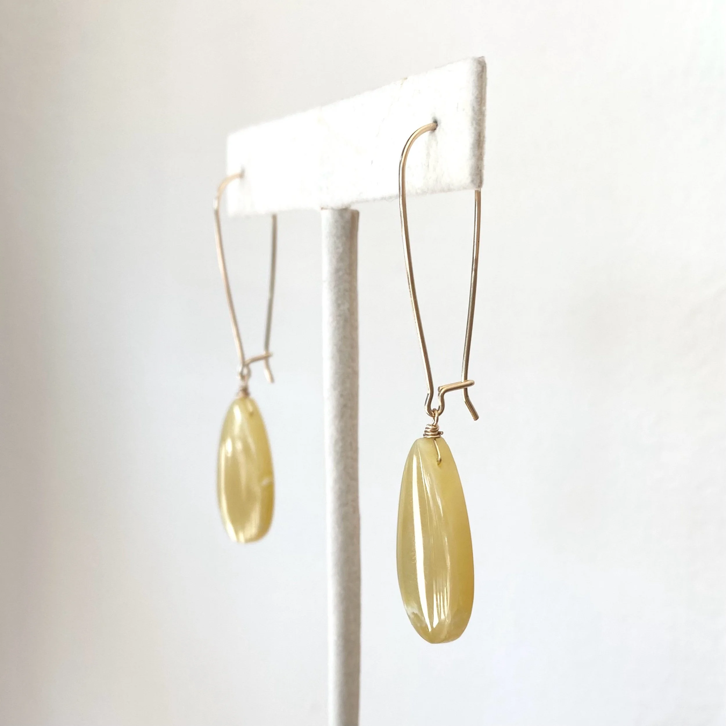 yellow opal gold filled wire wrapped dangly earrings on stand Kim Drosdick Toronto