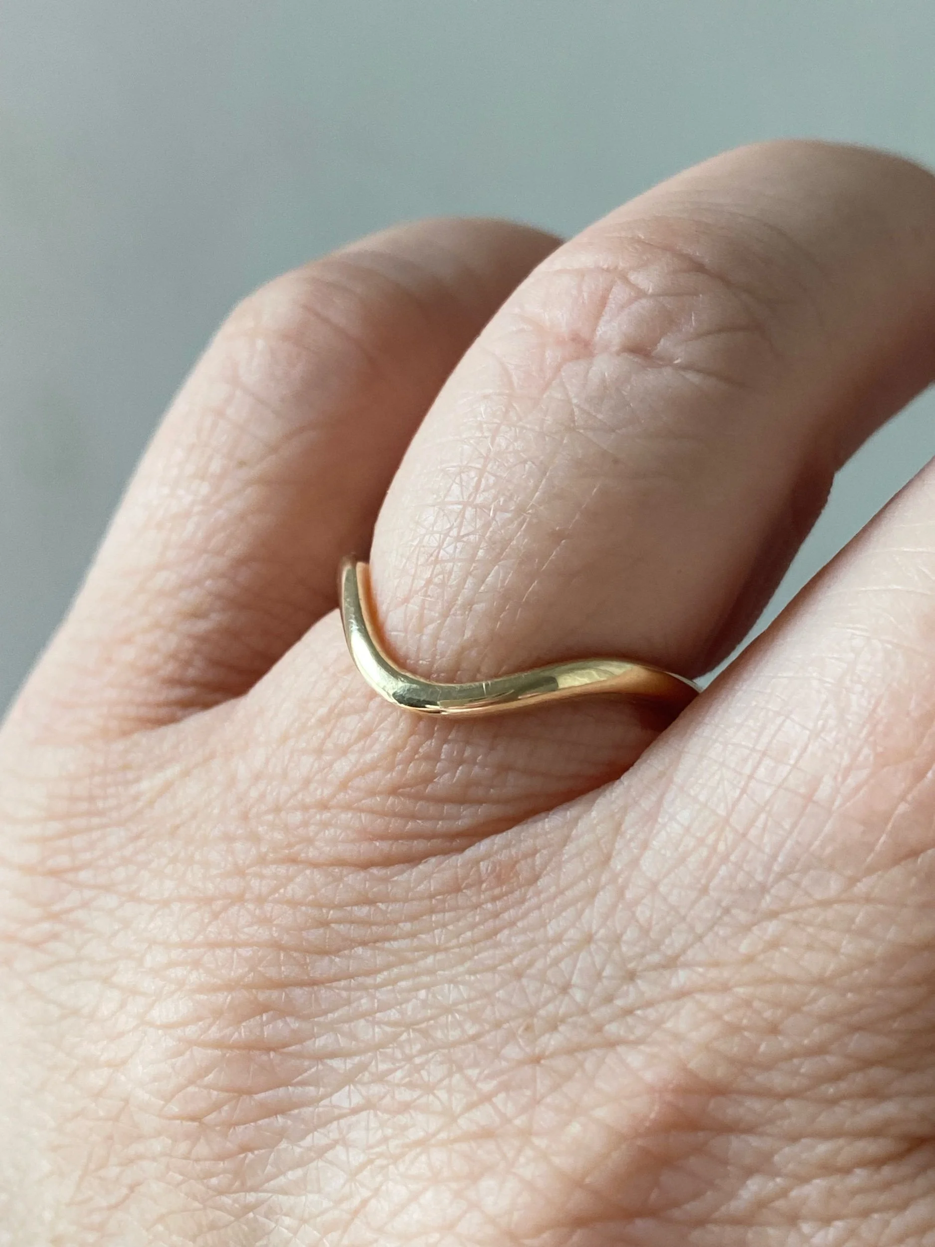 deep contour wedding ring 14k yellow recycled gold modern curved on hand kim drosdick toronto