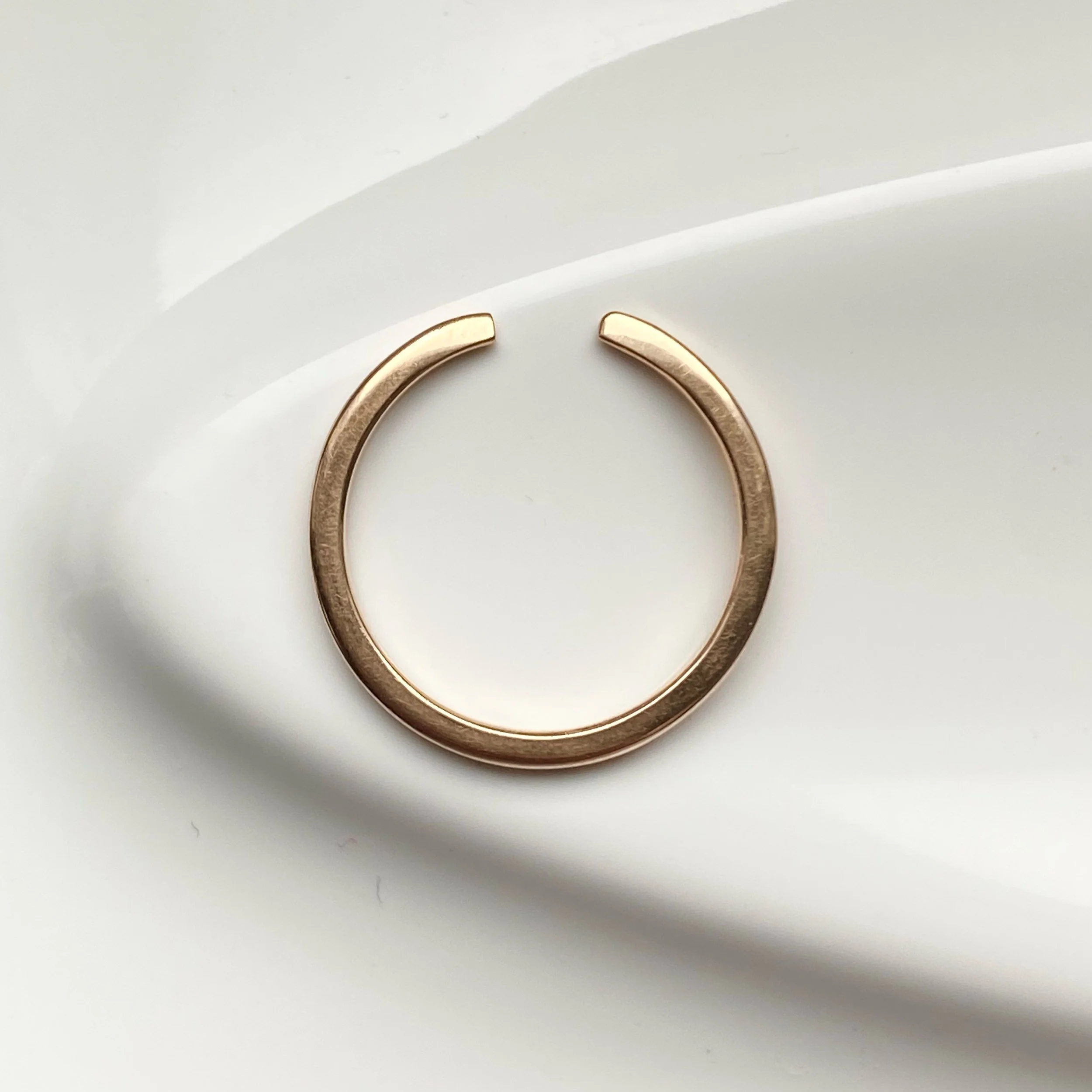 open design wedding stacking ring 14k recycled rose gold rounded narrow band side view on side Kim Drosdick Toronto