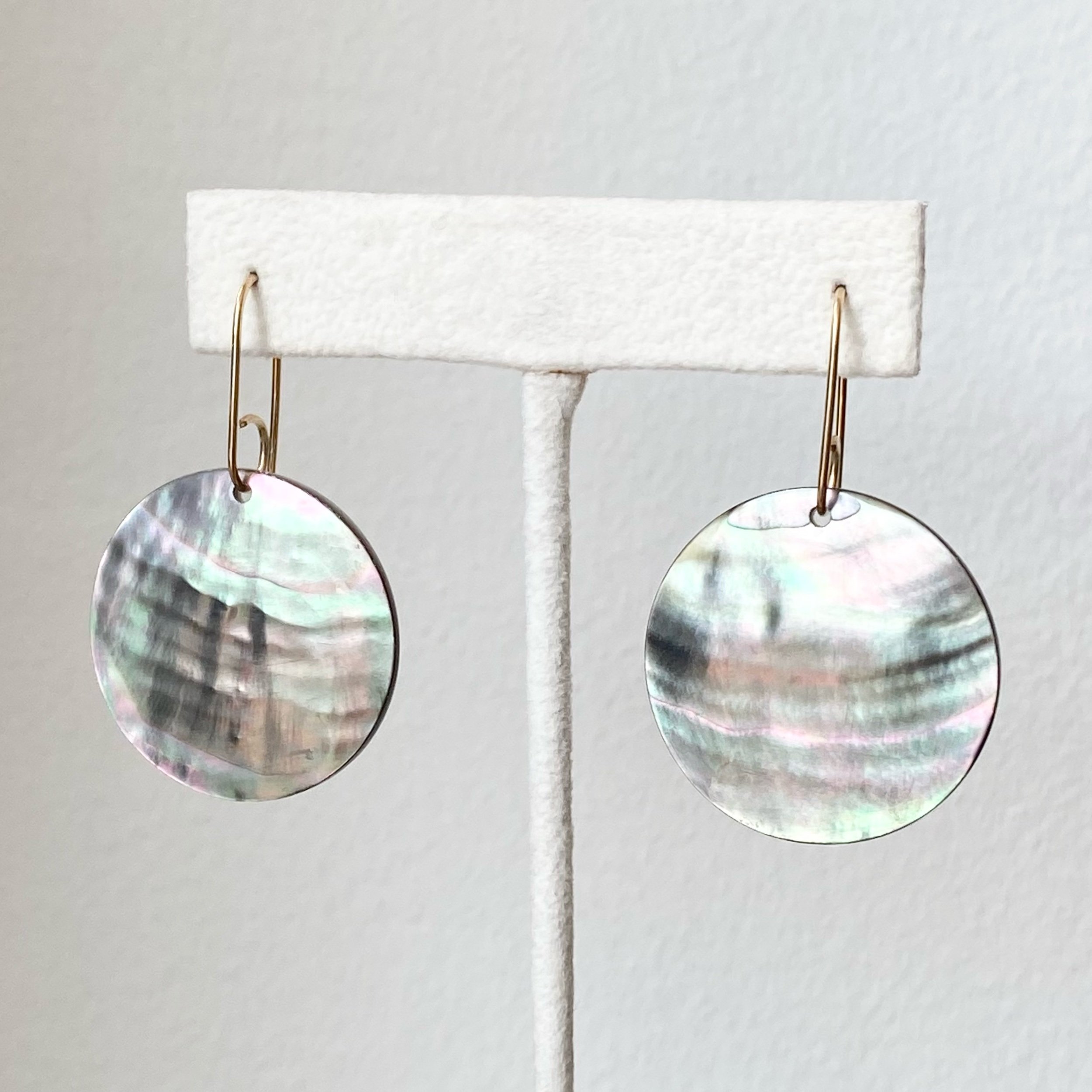 black mother of pearl earrings on earring stand Kim Drosdick Jewellery Toronto