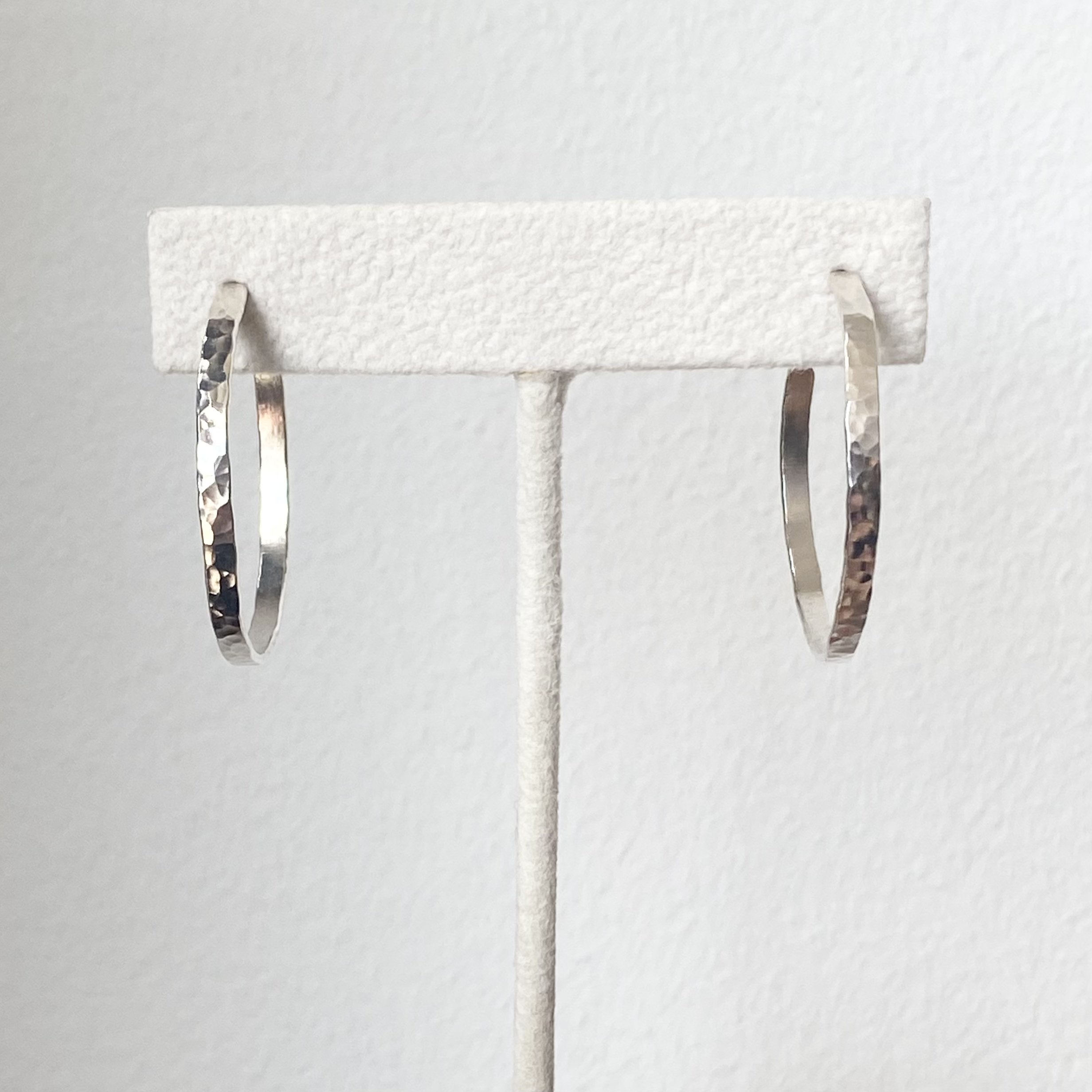 sterling silver hammered hoop earrings on display Kim Drosdick