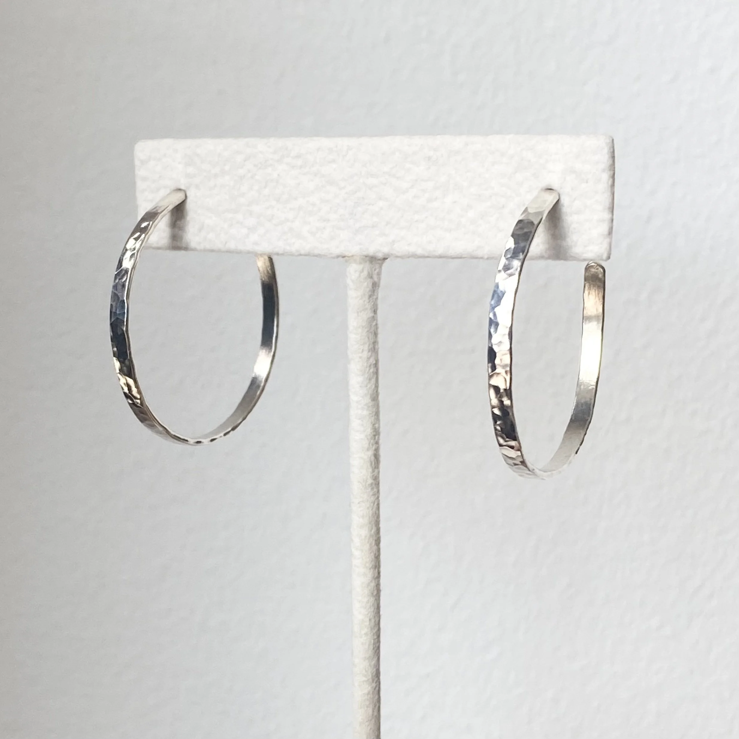 sterling silver hammered hoop earrings on display Kim Drosdick Toronto