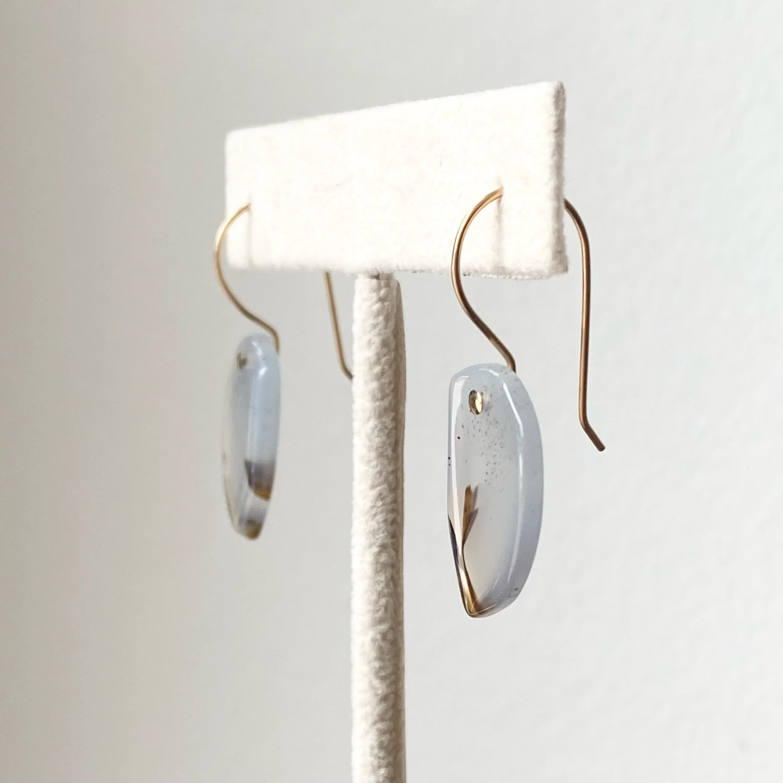 organic tear drop Montana agate earrings gold filed ear wires on stand side view Kim Drosdick jewellery Toronto