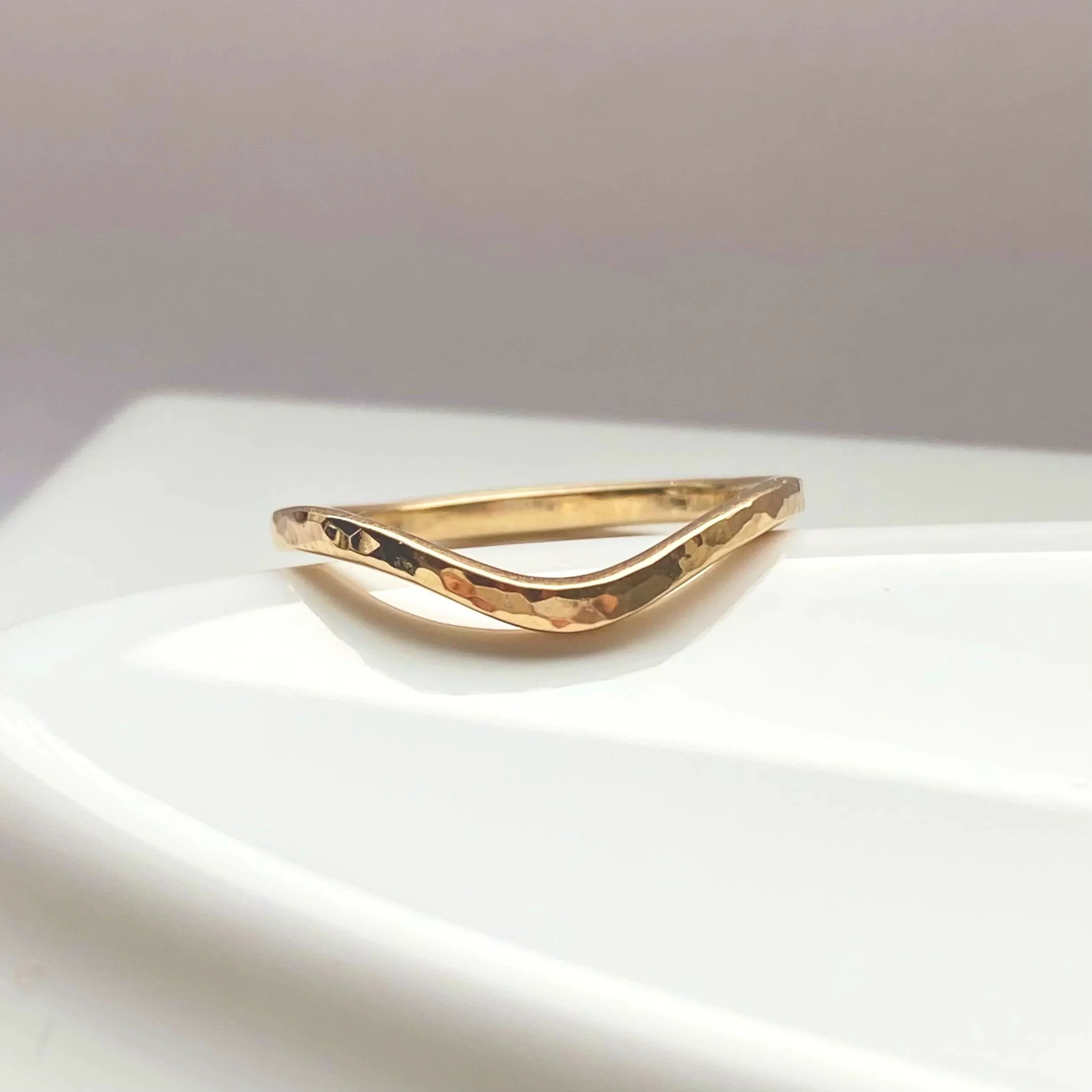 narrow hammered recycled 14k yellow gold contour wedding ring stacking band polished on dish boho organic vintage kim drosdick toronto